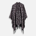 Cape poncho femme léopard gris noir franges, vue de face sur fond blanc