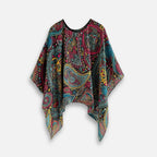Cape poncho femme multicolore motif cachemire col rond présentée à plat vue de face