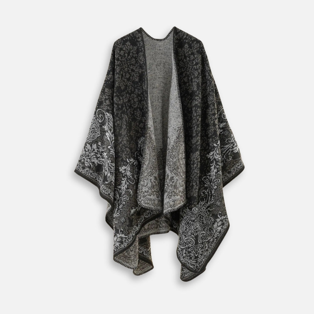 Cape poncho femme réversible motif floral gris anthracite présentée à plat sans manches