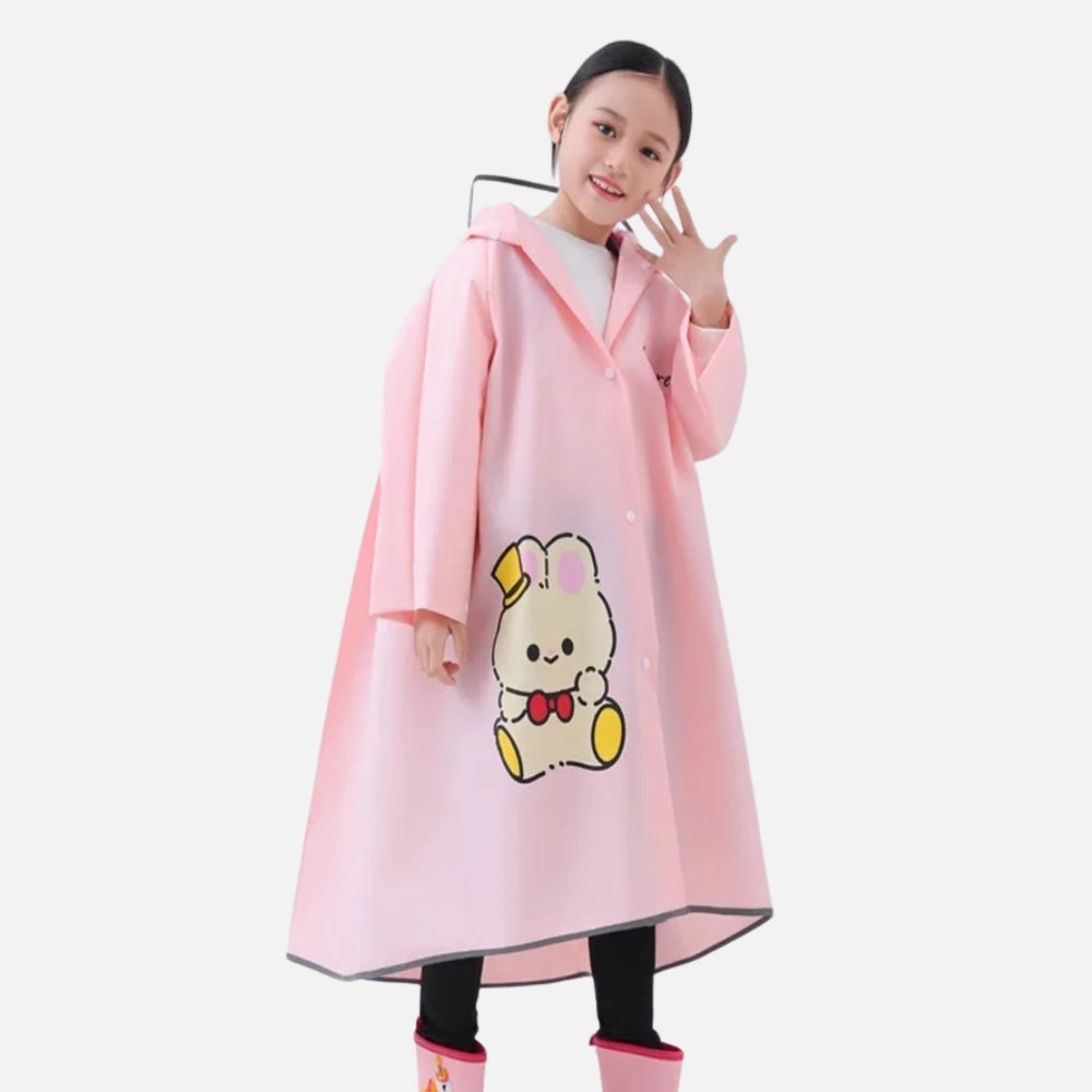 Enfant portant poncho pluie rose avec capuche et motif lapin mignon, manches longues