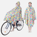 Poncho pluie vélo femme capuche visière motifs géométriques colorés jaune bleu rose