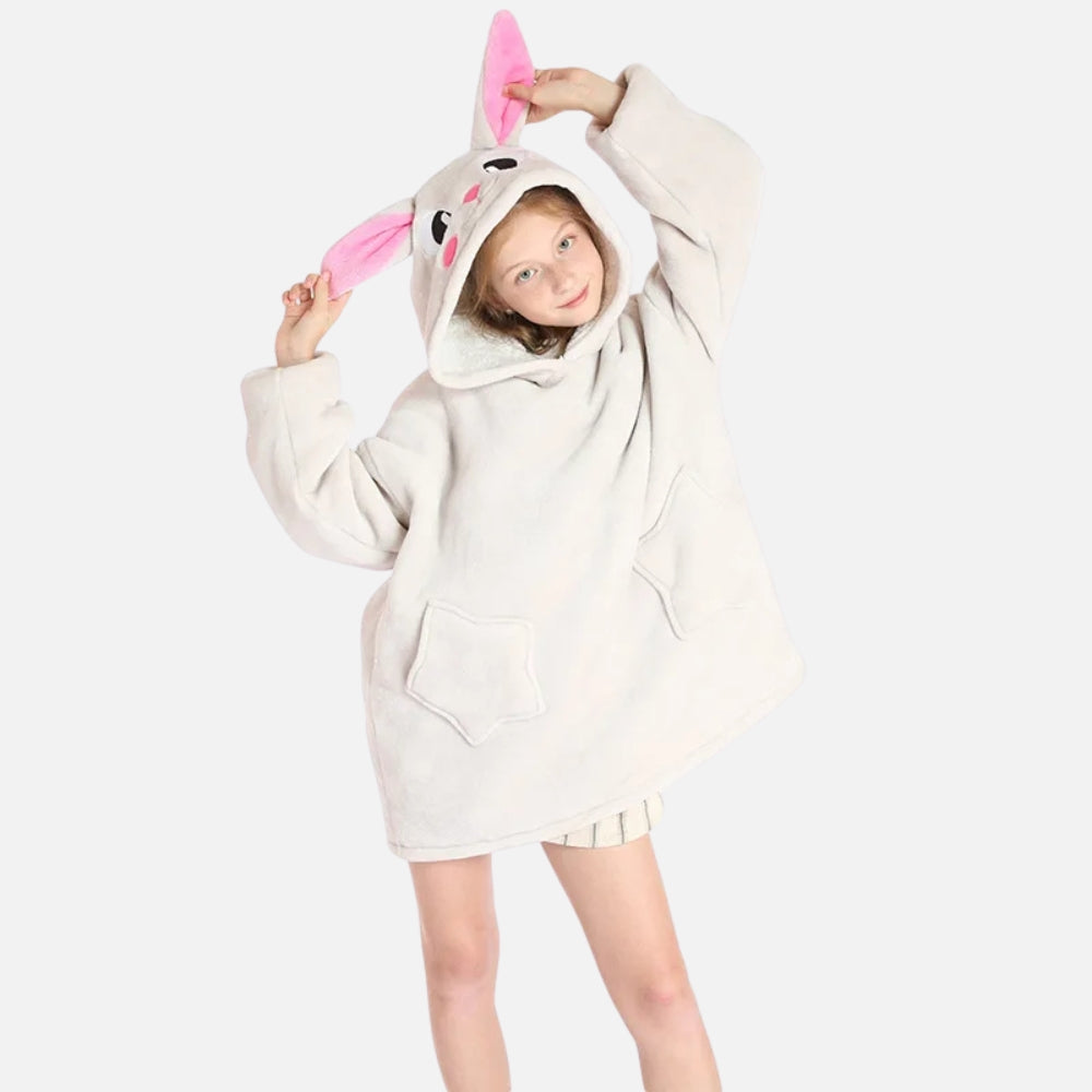 Enfant portant un poncho polaire beige à capuche lapin avec oreilles roses et poche ventrale