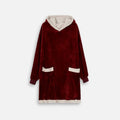 Poncho polaire sherpa rouge avec capuche beige, poches et ourlet contrastants, vue de face