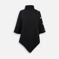 Pull poncho noir femme col montant avec boutons dorés, coupe ample et asymétrique
